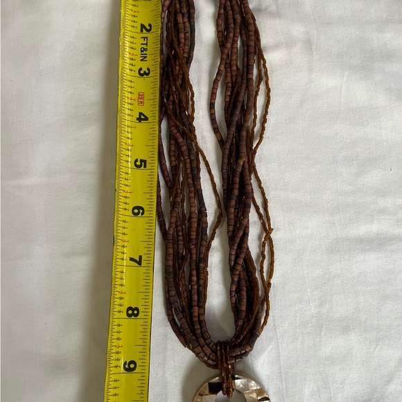 Brown beaded necklace with medallion - Picture 6 of 7